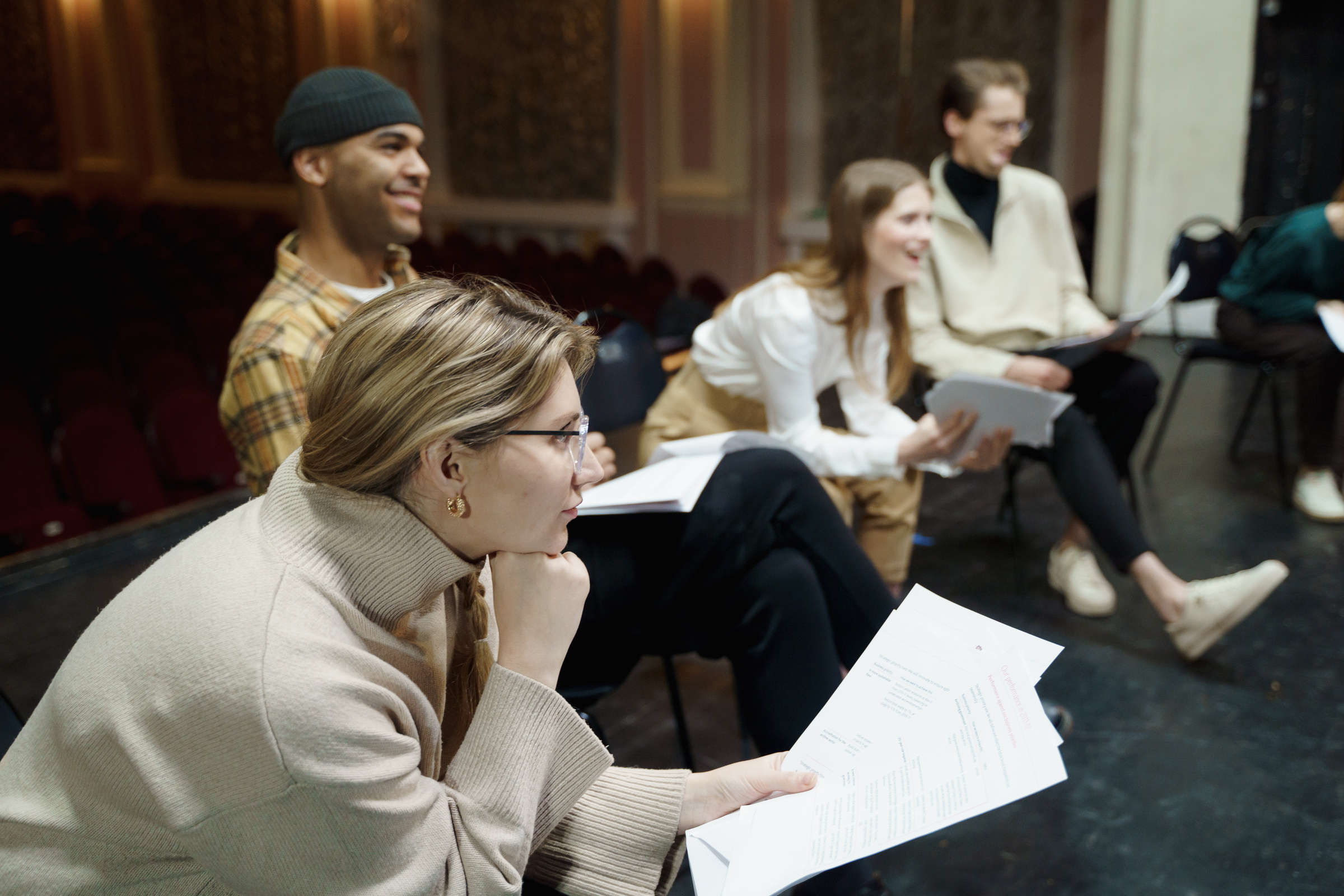 Group Of People Sitting With Their Scripts